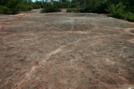 Skid marks on an Aboriginal rock engravings site.