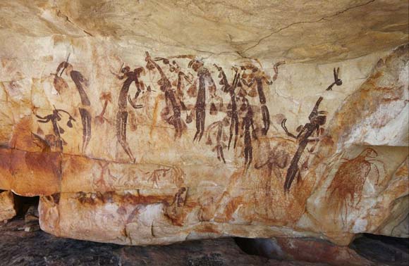 Photo of Gwion Gwion (Bradshaw) paintings on a rock wall.