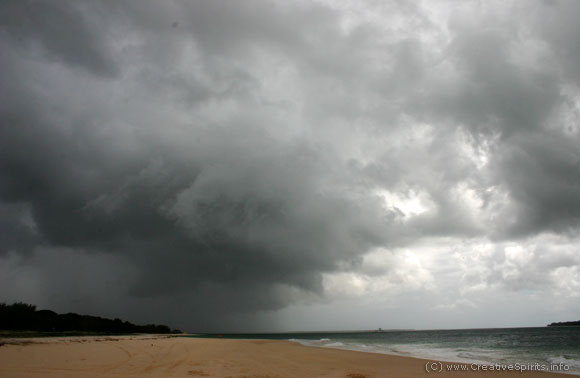 Dark storm clouds over a beach in Queensland