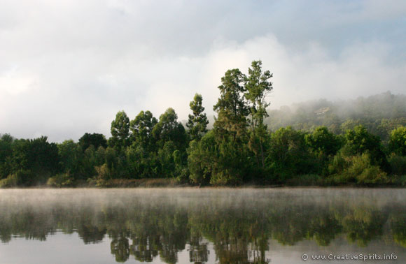 A misty morning over a river.