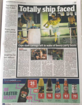 An article about Australian youth's alcohol consumption is seen besides an advert for alcohol.