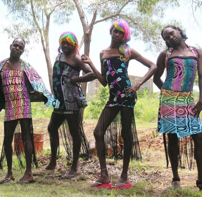 A group of colourfully clothed sistergirls from Tiwi Island.