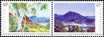 One stamp shows a white-barked ghost gum, another a solitary mountain.