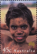 Headshot of a very young girl looking into the camera.