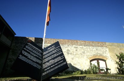 A memorial for John Pat in front of the prison walls of Fremantle Prison.