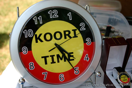 Koori Time clock in Aboriginal colours.
