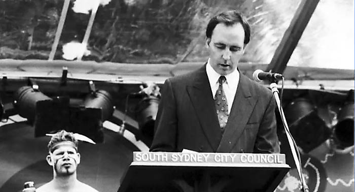 Paul Keating is standing at a lectern delivering his speech