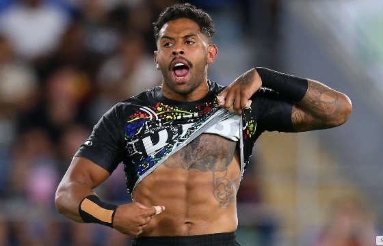 Josh Addo-Carr points to the black skin of his belly.