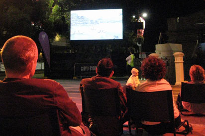 Video screening of First Australians on Taylor Square, Sydney.