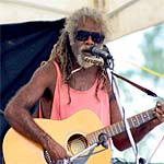 Ashley Coleman playing his guitar.