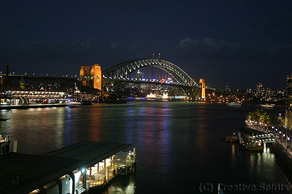 Sydney Cove. Circular Quay with Harbour Bridge at night, viewed from the Cahill Expressway.