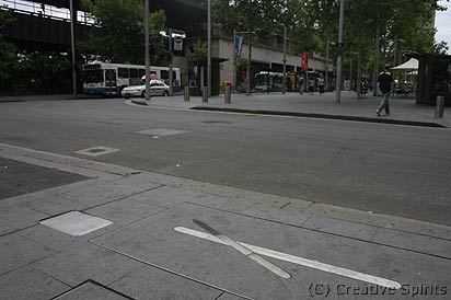 Tank Stream artwork. Looking over Pitt Street northeast. In the foreground the first artwork with the plaque to the left. Alfred Street in the distance where the bus is.