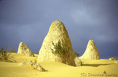 Nambung National Park. A city? No, just the Pinnacles with a dark clouded background.
